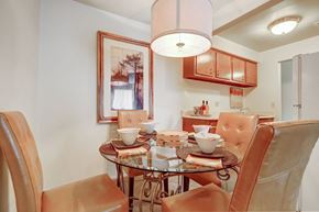Fairview Park apartment for rent - a dining room table with chairs and a chandelier