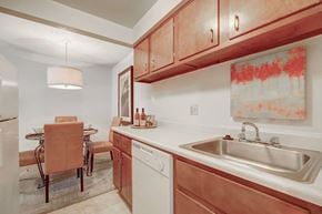 Fairview Park apartment for rent - a kitchen with a sink and a table with chairs