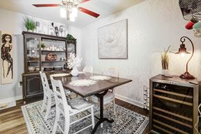 Parma apartment for rent - A dining room with a table and chairs.