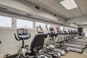Lakewood apartment for rent - a row of cardio machines in a gym