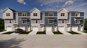 Asheville apartment for rent - A large, modern house with a grey and white exterior and a car parked in the driveway.