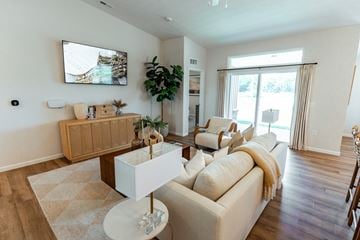 Beavercreek apartment for rent - A living room with a white couch and a wooden coffee table.