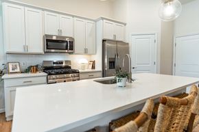 Beavercreek apartment for rent - A kitchen with white cabinets and a white countertop.