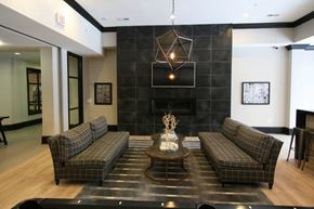 Rocky River apartment for rent - A living room with a fireplace and two couches.