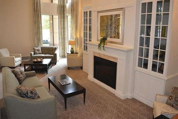 Pittsburgh apartment for rent - A living room with a fireplace and a painting on the wall.
