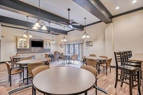 Pittsburgh apartment for rent - A spacious dining area with a large table surrounded by chairs.