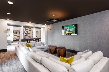 Huntersville apartment for rent - a living room with couches and a tv on the wall