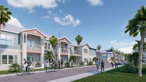 Key West apartment for rent - A group of people are riding bikes on a path in front of a row of townhouses.