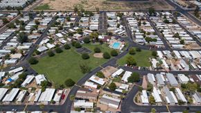 Glendale apartment for rent - A bird's eye view of a neighborhood with houses and a green space.