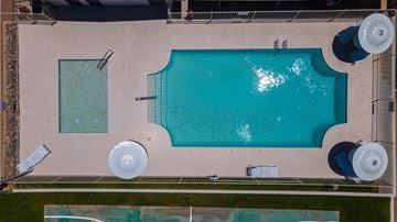 Glendale apartment for rent - A large rectangular pool with a smaller square pool next to it.