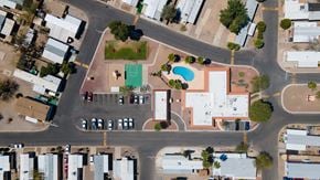 Tucson apartment for rent - A view of a street with cars and buildings.