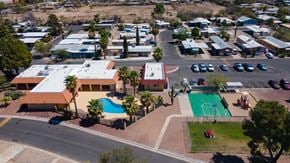 Tucson apartment for rent - A view of a resort with a swimming pool and a basketball court.