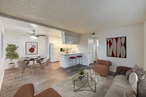 Bakersfield apartment for rent - an open living room and kitchen with a table and chairs