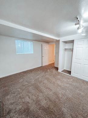 Lakewood apartment for rent - an empty bedroom with a closet and a window