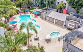 Fresno apartment for rent - an aerial view of a pool and a resort style swimming pool