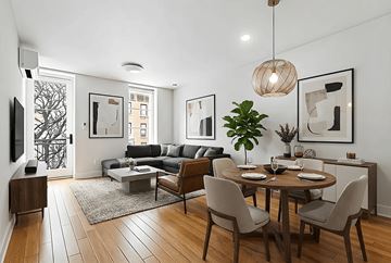 Brooklyn apartment for rent - A modern living room with a dining table set for two.