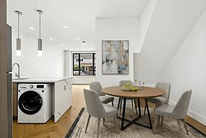 Brooklyn apartment for rent - A modern kitchen with a dining table and chairs.