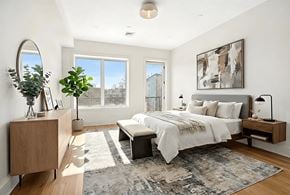 Brooklyn apartment for rent - A bedroom with a large bed and a large window.
