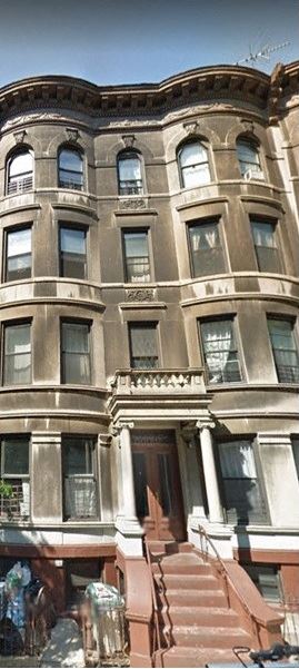 Brooklyn apartment for rent - A large, old building with a staircase leading to the front door.