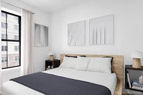 Brooklyn apartment for rent - A bedroom with a large bed and two nightstands.