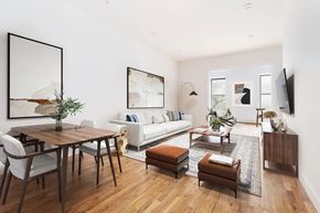 Brooklyn apartment for rent - A modern living room with a wooden floor and furniture.