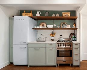 Brooklyn apartment for rent - A kitchen with a white refrigerator and a stove top oven.