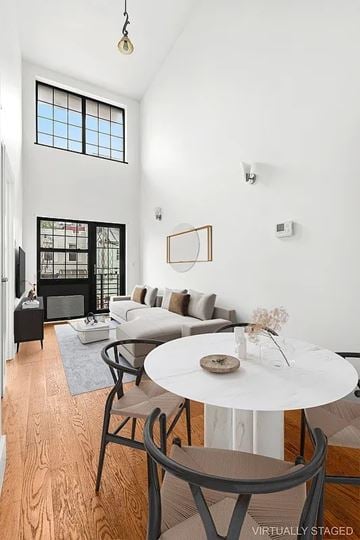 Brooklyn apartment for rent - A living room with a white table and chairs.