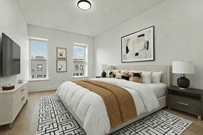 Brooklyn apartment for rent - A bedroom with a large bed and a television.