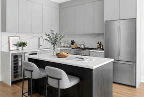 Brooklyn apartment for rent - A modern kitchen with a marble backsplash and stainless steel appliances.