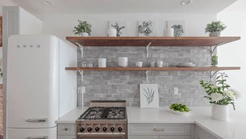 Brooklyn apartment for rent - A modern kitchen with a white refrigerator and a white stove top oven.