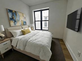 Brooklyn apartment for rent - A bedroom with a large bed and a painting on the wall.