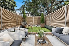 Brooklyn apartment for rent - A patio with a table, chairs, and a couch.