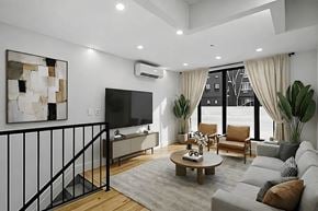 Brooklyn apartment for rent - A modern living room with a flat screen TV, a coffee table, and a balcony with a railing.