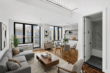 Brooklyn apartment for rent - A living room with a grey couch and a coffee table.
