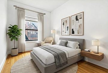 Brooklyn apartment for rent - A bedroom with a large bed and a window with curtains.