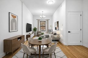 Brooklyn apartment for rent - A modern dining room with a wooden table and chairs.