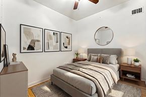 New York apartment for rent - A bedroom with a bed, nightstands, and a ceiling fan.