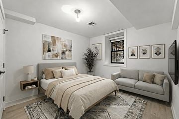 Brooklyn apartment for rent - A bedroom with a large bed and a couch.