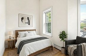 Brooklyn apartment for rent - A bedroom with a bed, a chair, and a window.