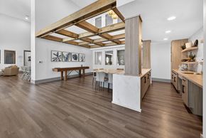 Holly Hill apartment for rent - A kitchen with a wooden floor and a white wall.