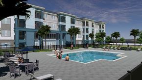 Crystal River apartment for rent - A group of people are sitting around a pool on a patio.