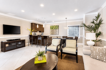 Homestead apartment for rent - A modern living room with a brown coffee table and a white couch.