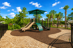 Spring Hill apartment for rent - A playground with a green slide and a brown gravel area.