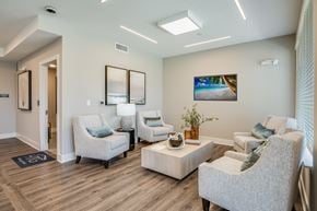 Bradenton apartment for rent - A living room with a couch, chair, and a coffee table.