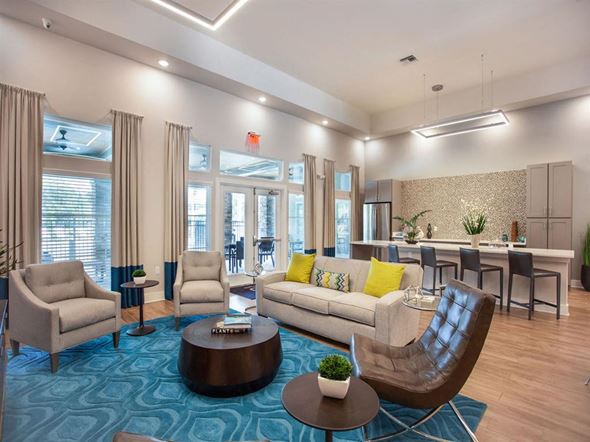 Spring Hill apartment for rent - A living room with a blue carpet and furniture.