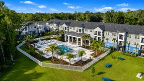 Holly Hill apartment for rent - A large building complex with a pool in the middle.