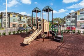 Lakeland apartment for rent - playground at the enclave at woodbridge apartments in sugar land, tx