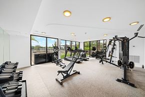 Aventura apartment for rent - A spacious home gym with a variety of equipment.