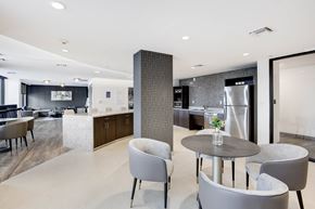 Fort Lauderdale apartment for rent - a room with a table and chairs and a kitchen in the background