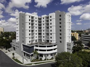 Miami apartment for rent - an aerial view of the hotel with a blue sky and white clouds in the background